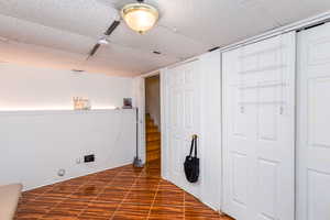 Washroom with wood finished floors and baseboards
