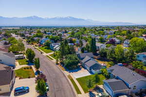 Aerial perspective of suburban area with a mountainous background