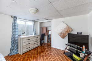 Living area featuring a paneled ceiling