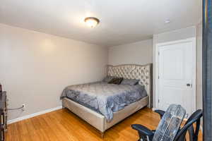 Bedroom featuring wood finished floors