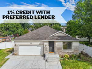 View of front of property with stone siding, stucco siding, concrete driveway, and an attached garage