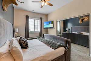 Bedroom with carpet and a ceiling fan