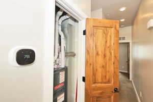 Remote Accessed Thermostat. New Furnace. Hall with recessed lighting and carpet floors