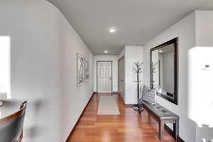 Hall featuring recessed lighting and wood finished floors