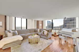 Living room with plenty of natural light and light wood-style floors
