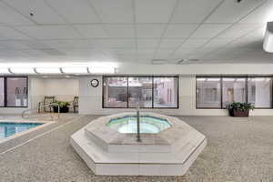 View of pool featuring a hot tub
