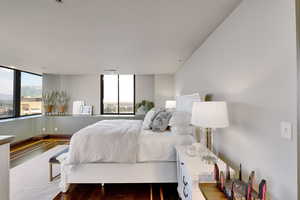 Bedroom with hardwood / wood-style floors