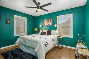 Bedroom with wood finished floors and ceiling fan