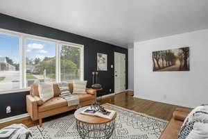 Living room featuring wood finished floors and baseboards