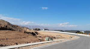 View of asphalt street with a mountain view