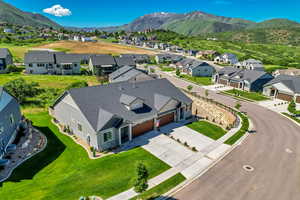 Aerial view of residential area featuring a mountain backdrop