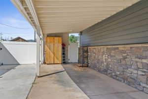 View of patio featuring a carport