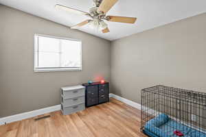 Unfurnished bedroom featuring light wood-style flooring and ceiling fan