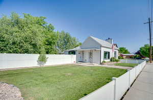View of front of house featuring a fenced backyard