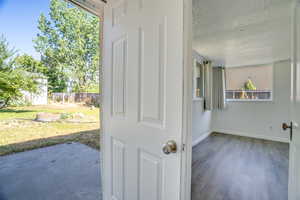 Spare room featuring baseboards and wood finished floors
