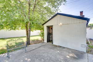 View of patio / terrace with an outbuilding
