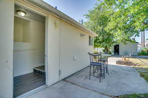 View of patio / terrace featuring outdoor dining area and an outdoor structure