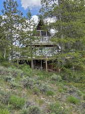 Rear view of house with a wooden deck