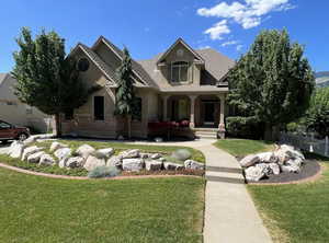 View of front of home with brick siding and a porch