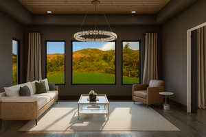 Living area with a tray ceiling, wooden ceiling, wood finished floors, and recessed lighting