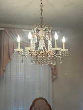 Detailed view of a chandelier and a textured ceiling