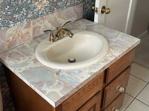Bathroom view of vanity and baseboards