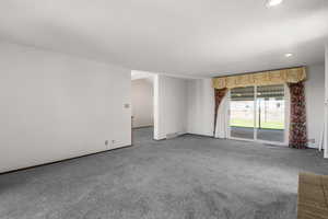 Unfurnished room featuring carpet flooring, recessed lighting, and a textured ceiling