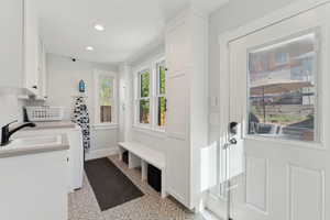 Laundry room with recessed lighting and lots of storage cabinet space