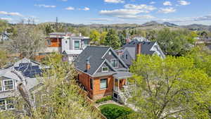 Aerial view of residential area featuring a mountainous background