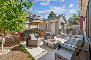 View of patio with an outdoor living space, new ervgarage, and grilling area