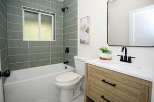 Full bathroom featuring vanity and  shower combination