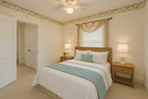 Digitally Staged: Bedroom with light carpet and a ceiling fan