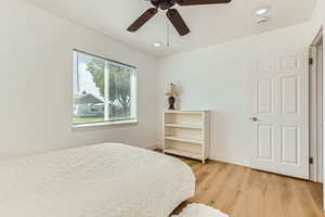 Bedroom featuring light wood-style flooring, recessed lighting, and a ceiling fan