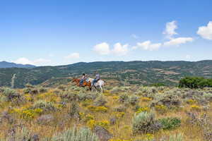 View of mountain background featuring rural landscape