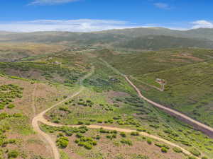 View of property location featuring a mountainous background and rural landscape