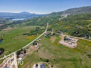 View of property location featuring a water and mountain view