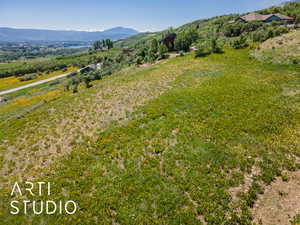View of mountain background featuring rural landscape