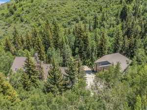 View from above of property with a forest