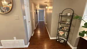 Hall featuring wood finished floors