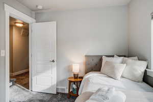 Carpeted bedroom with baseboards
