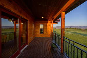 kitchen deck with a view of rural / pastoral area and a mountain view