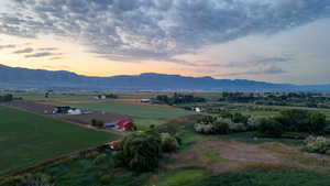 View of mountain backdrop featuring rural landscape