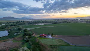 Aerial view at dusk of a view of rural / pastoral area and a mountain view