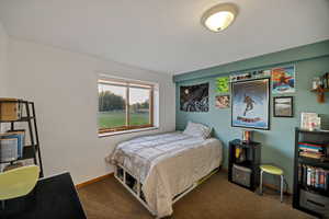 Bedroom with carpet and baseboards 2/5
