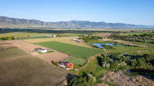 Aerial overview of property's location featuring rural landscape and a water and mountain view