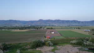 View of mountain backdrop with rural landscape and extensive farmland