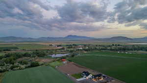 Aerial overview of property's location featuring rural landscape and a water and mountain view