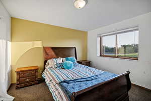 Carpeted bedroom with baseboards 1/5