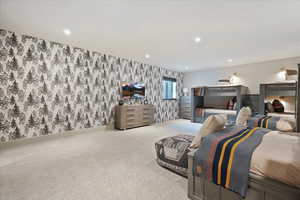 Basement Bedroom featuring wallpapered walls, carpet, and recessed lighting