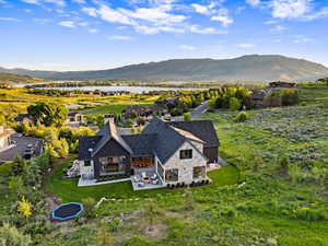 View from above of property with a water and mountain view